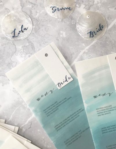 Layered watercolour vellum & calligraphy menus
